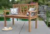 A wooden bench with nautical-themed pillows sits on a patio next to a pond with a waterfall. Produktbild-Vorschau