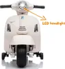 Front view of a white children's electric scooter with an orange arrow pointing to the LED headlight and text indicating 'LED headlight'. Podgląd zdjęcia produktu