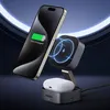 A smartphone and wireless earbuds are charging on a magnetic wireless charging stand. Produktbild-Vorschau