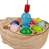 A close-up shot of a wooden magnetic fishing game for toddlers, featuring colorful fish and a cat-shaped board. Náhled obrázku produktu