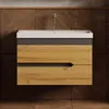 A modern bathroom vanity with a ceramic sink and wooden drawers, set against a tiled wall. Produktbild-Vorschau