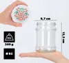 A hand holds a decorative lid above a glass jar, with dimensions and weight information displayed. Produktbild-Vorschau