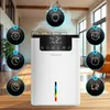 A modern white dehumidifier with a digital display and various illuminated icons surrounding it, set in a bright living room with wooden flooring. Náhled obrázku produktu
