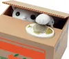 A coin-collecting cat toy peeking out of a cardboard box. Náhľad obrázku produktu