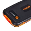 Close-up view of the top and side of a black and orange power bank. Náhled obrázku produktu