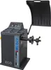 A dark gray wheel balancing machine with a black protective cover raised, set against a white background. Produktbild-Vorschau