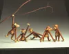 Five wooden monkey toys are arranged on a surface with a branch overhead. Náhled obrázku produktu