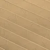 A close-up, textured view of a pleated fabric, likely a blind or shade, in a light brown or cappuccino color. Produktbild-Vorschau