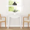 A white dining table with two chairs in a bright room with a window. Náhľad obrázku produktu
