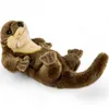 A plush toy otter lying on its back against a white background. Produktbild-Vorschau