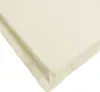 A close-up view of a cream-colored cushion or mat, showing its textured fabric and stitched edge. Voir les images du produit