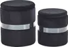 Two black velvet ottomans with a silver band around the middle, shown on a white background. Náhled obrázku produktu