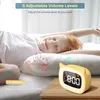 A child sleeping in bed with an alarm clock next to them. Produktbild-Vorschau