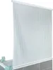 A shower roller blind with vertical stripes hanging over a bathtub. Podgląd zdjęcia produktu