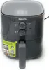 A dark gray Philips air fryer is shown against a white background. The air fryer has a digital display on top and two knobs on the front for controls. A yellow sticker with text and a QR code is attached to the side of the air fryer. Produktbild-Vorschau