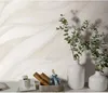 A close-up view of a wall with a textured wallpaper pattern, featuring two white vases with green eucalyptus branches on a surface in front of it. Produktbild-Vorschau