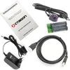 A collection of electronic accessories, including a manual, cables, batteries, and an IR receiver, laid out on a white background. Produktbild-Vorschau