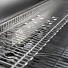 A close-up view of a stainless steel grill grate. Produktbild-Vorschau