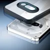 A close-up, angled view of a transparent phone case with a black frame, hovering over the back of a phone. Produktbild-Vorschau