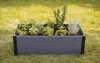 A raised garden bed filled with various herbs and plants, placed on a grassy lawn. Náhľad obrázku produktu