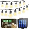 A string of solar-powered LED lights with a solar panel charger and packaging. Náhľad obrázku produktu