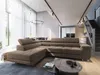 A modern living room with a large sectional sofa, dining area, and staircase. Produktbild-Vorschau
