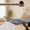 An ironing board with an attached garment hanger, set in a domestic living room environment. Produktbild-Vorschau