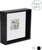 A black shadow box photo frame with a small floral print inside, set against a white background. There are also three small circles at the bottom right, two white and one black, likely representing color options. Produktbild-Vorschau