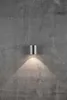 A silver cylindrical wall light fixture is mounted on a textured gray concrete wall, casting a warm light downwards. Anteprima dell’immagine prodotto