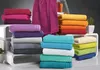 Stacks of folded towels in various colors. Produktbild-Vorschau