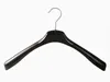 A single black hanger on a white background. Produktbild-Vorschau