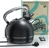 A black retro-style electric kettle is displayed prominently in front of its packaging. Produktbild-Vorschau