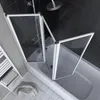 A shower screen is installed over a bathtub in a bathroom. Produktbild-Vorschau