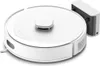 A white robot vacuum cleaner is shown with its charging dock attached to the right side. Náhled obrázku produktu