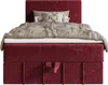 A studio shot of a bed with a red upholstered base and headboard, featuring a beige blanket and gray throw pillow. Produktbild-Vorschau