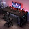 A gaming desk setup with a computer, monitor, keyboard, mouse, headphones, and chair, illuminated by RGB lighting. Podgląd zdjęcia produktu