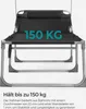 A close-up view of a black and gray lounge chair with text overlay indicating its weight capacity. Náhled obrázku produktu