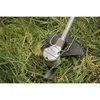 A string trimmer cutting grass. Voir les images du produit