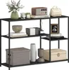 A black metal console table with four shelves, displaying various decorative items. Podgląd zdjęcia produktu