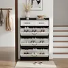 A shoe cabinet with drawers and flip-out compartments is shown in a hallway next to a staircase. Anteprima dell’immagine prodotto