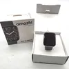 A smartwatch and its packaging are displayed on a white surface. Podgląd zdjęcia produktu