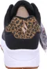The back view of a black sneaker with a leopard print accent on the heel. Anteprima dell’immagine prodotto