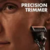 Close-up of a man's face with a razor being used. Anteprima dell’immagine prodotto