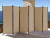A beige outdoor privacy screen is set up on a patio overlooking the ocean. Produktbild-Vorschau