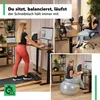 A collage of images showing a woman using a standing desk in different ways: walking on a treadmill, sitting at the desk, and sitting on an exercise ball at the desk. The text suggests the desk adapts to different activities. Produktbild-Vorschau
