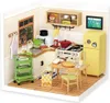 A miniature dollhouse kitchen scene with furniture and accessories. Podgląd zdjęcia produktu
