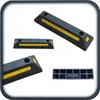 A collage of parking stops, also known as wheel stoppers or parking aids, with reflective yellow strips. Produktbild-Vorschau