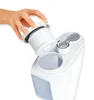 A hand is shown inserting a filter into a white humidifier. Podgląd zdjęcia produktu