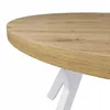 A close-up view of a round wooden table with white legs. Produktbild-Vorschau