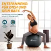 A pregnant woman is doing exercises on a gym ball in a bright room. Produktbild-Vorschau